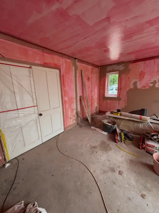 Light-filled room with beautiful cream plaster