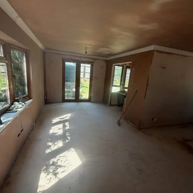 Bright spacious room with warm beige plaster