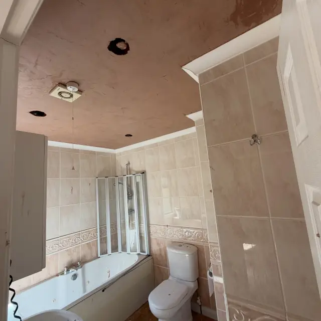 Open-plan living area showing finished plaster