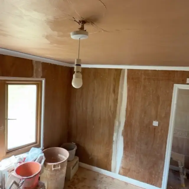 Bathroom with finished tile and plaster