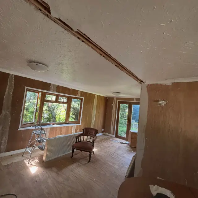 Orange-toned plaster in furnished room